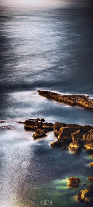 Ocean waves crashing on rocks