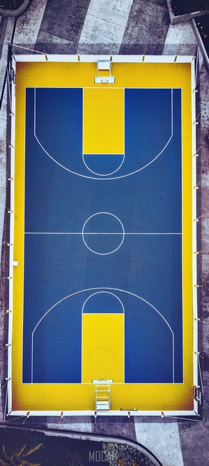 Aerial view of a blue and yellow basketball court