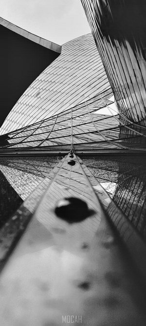 Modern building facade of metal and glass, monochrome