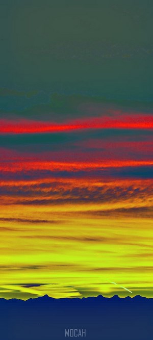 Sunset with colorful clouds over mountains