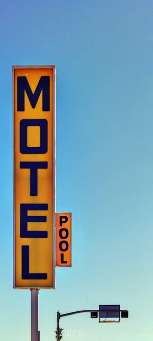 Motel sign with a pool sign