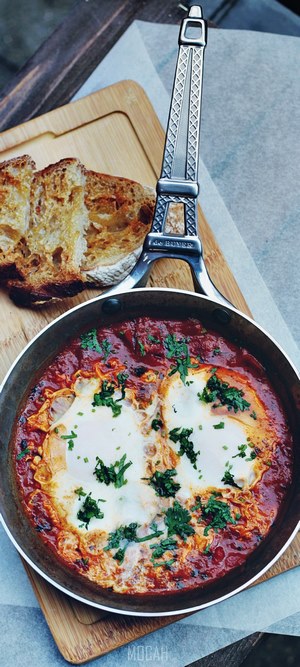Shakshuka with Toast and Eiffel Tower Figurine