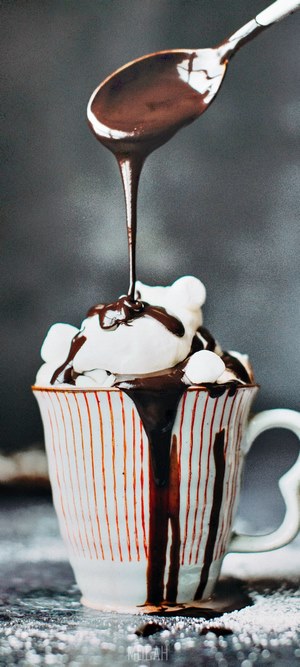 Hot chocolate with marshmallows and chocolate syrup