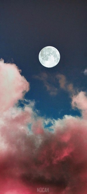 Full moon in a cloudy night sky