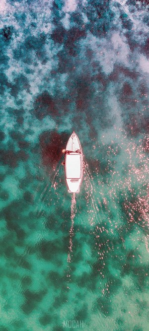 Aerial view of a boat on turquoise water