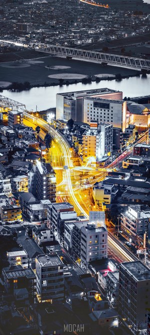 Night cityscape with illuminated roads and buildings