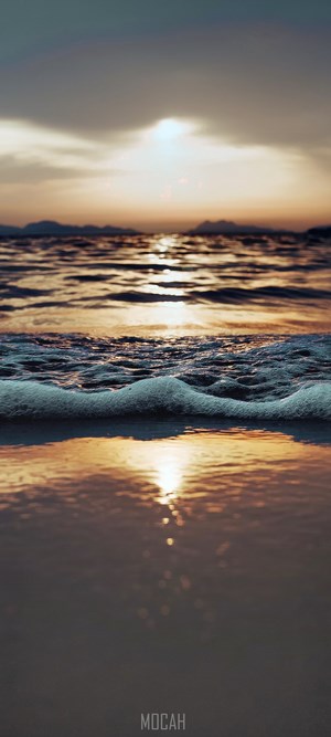 Sunset over the sea with gentle waves