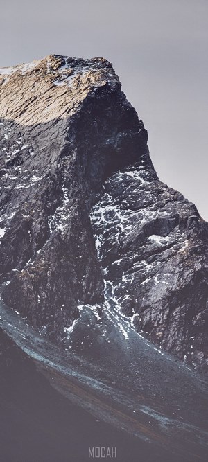 Close-up of a rocky mountain peak with snow