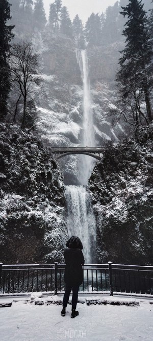 Person at Multnomah Falls in Winter