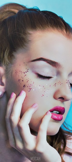 Woman with glitter and pink lipstick