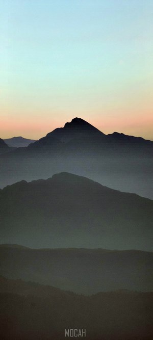 Mountain range at dusk with pastel sky