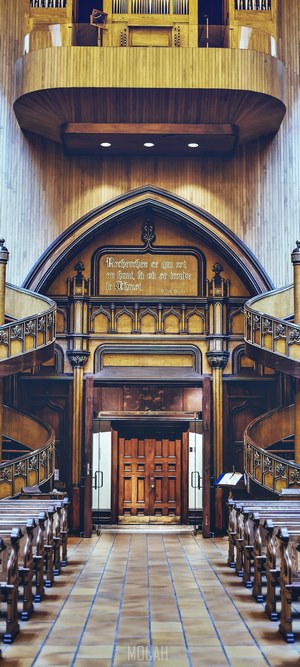 Church interior with organ and pews