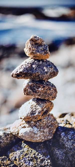 Stack of stones balanced on a rock
