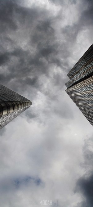 Two skyscrapers against a cloudy sky