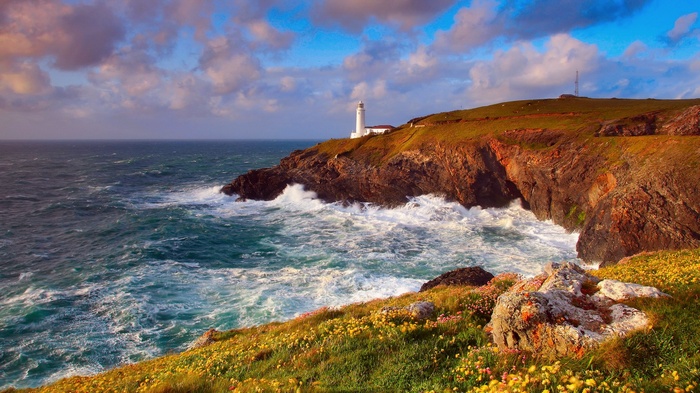 Lighthouse on a cliff overlooking the sea