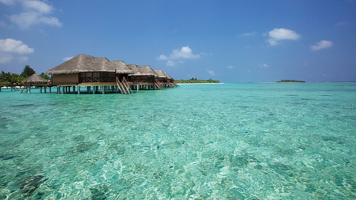 Overwater bungalows in a tropical lagoon