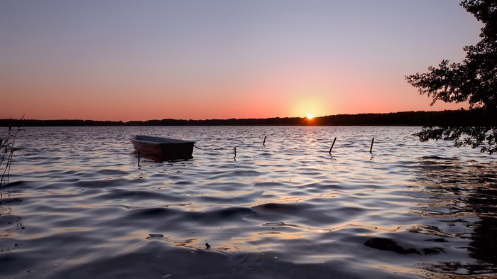 Boat on a lake at sunset
