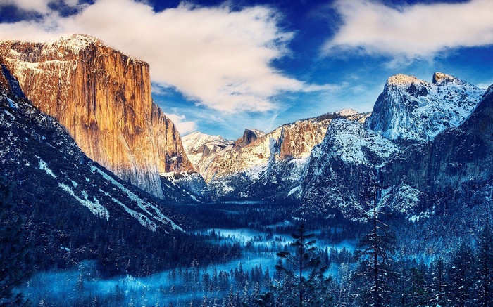 Snow-covered mountains and forest in Yosemite Valley