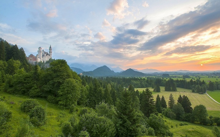 Neuschwanstein Castle in the Bavarian Alps at sunset