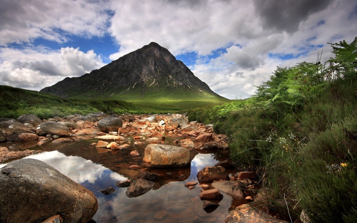 Mountain landscape with a stream and rocks