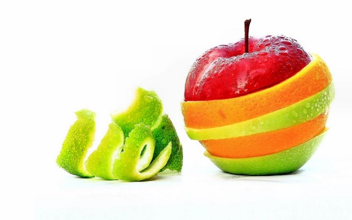 Apple and citrus fruit slices with lime peels