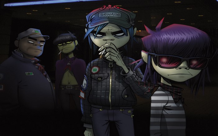 Gorillaz band members in a dark setting