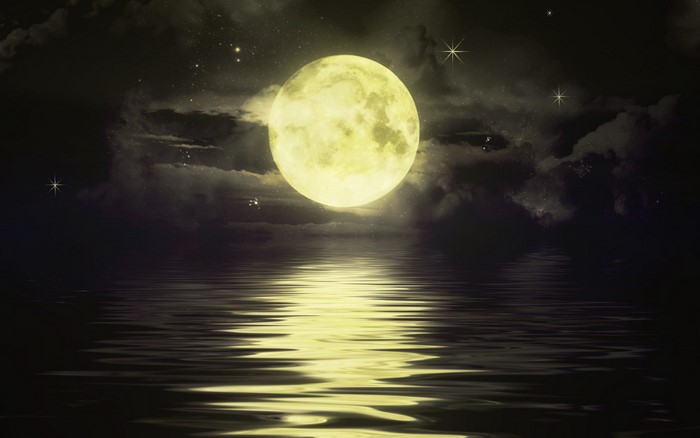Full moon reflected in water at night