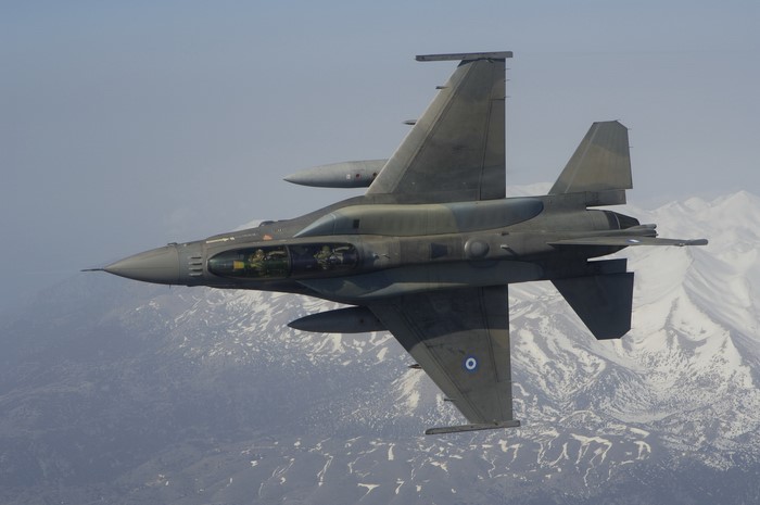 Greek F-16 Fighting Falcon flying over mountains