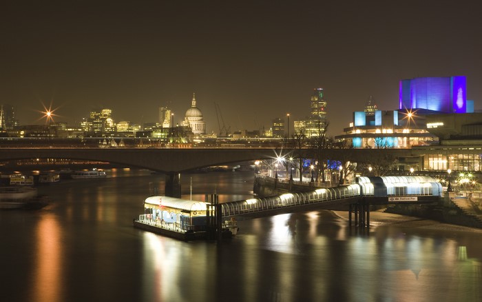 London skyline at night with River Thames and bridge