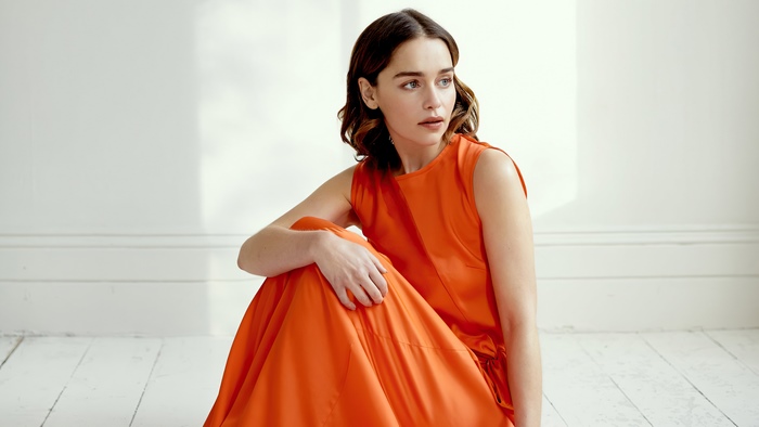 Emilia Clarke in orange dress