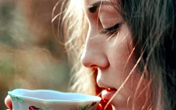 Woman drinking from a teacup