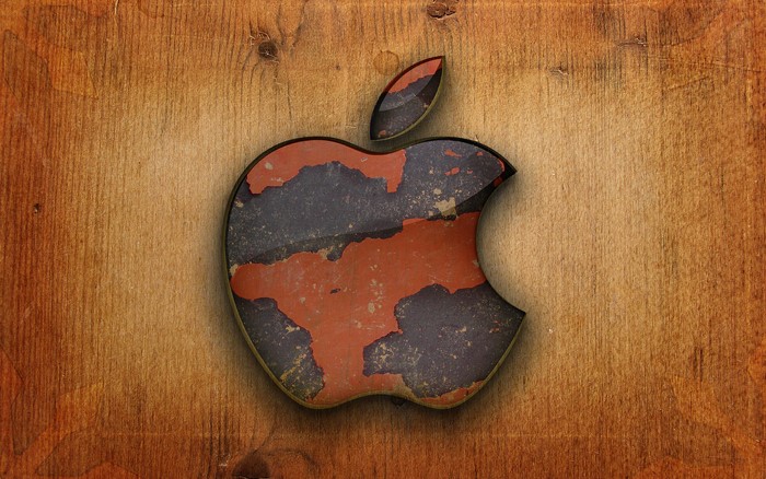 Apple Inc. logo on a wooden background
