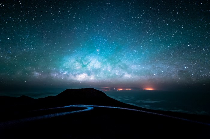 Milky Way over a mountain road at night