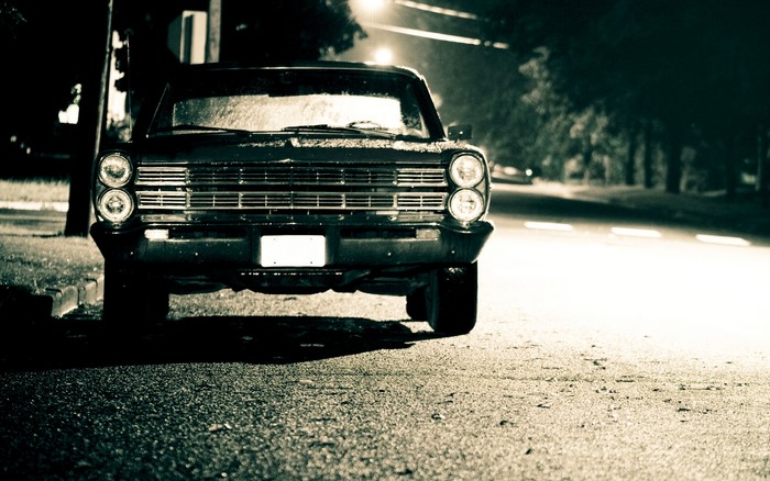 1960s Ford Galaxie parked at night