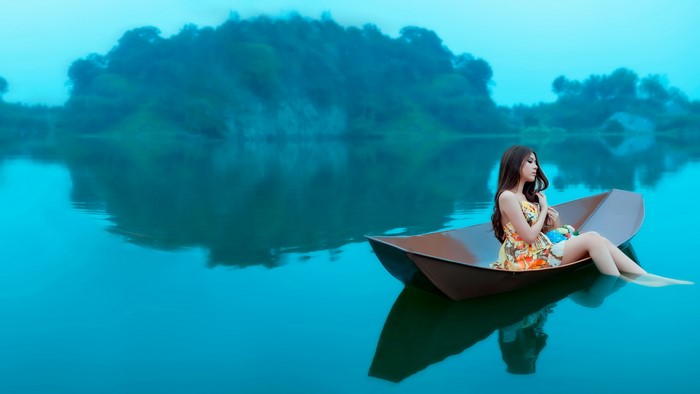 Woman in a boat on a lake