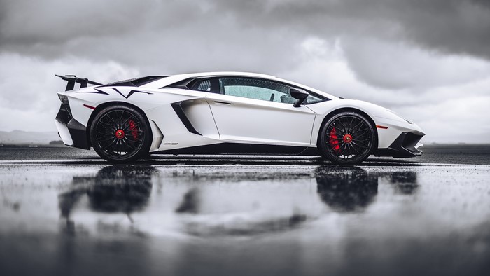 White Lamborghini Aventador SVJ on Wet Road