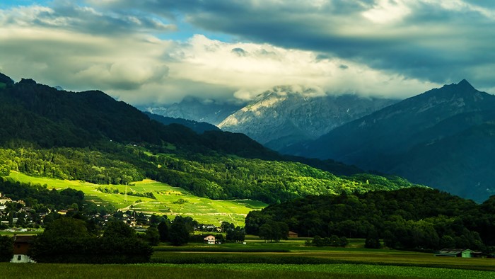 Mountain landscape with green hills and clouds