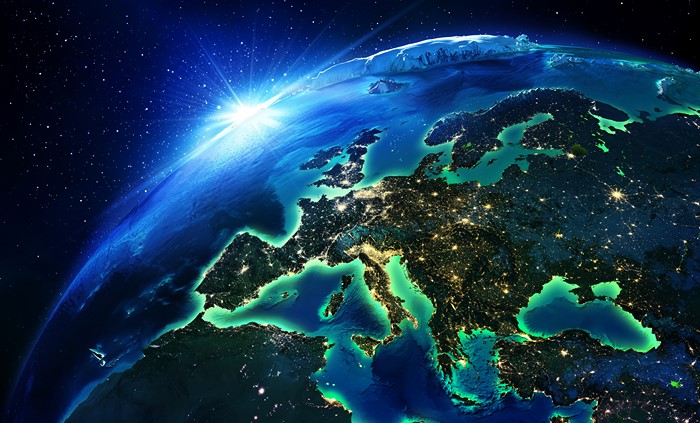 Earth from space with sun rising over Europe