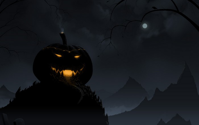 Scary Jack-o'-lantern on a hill at night