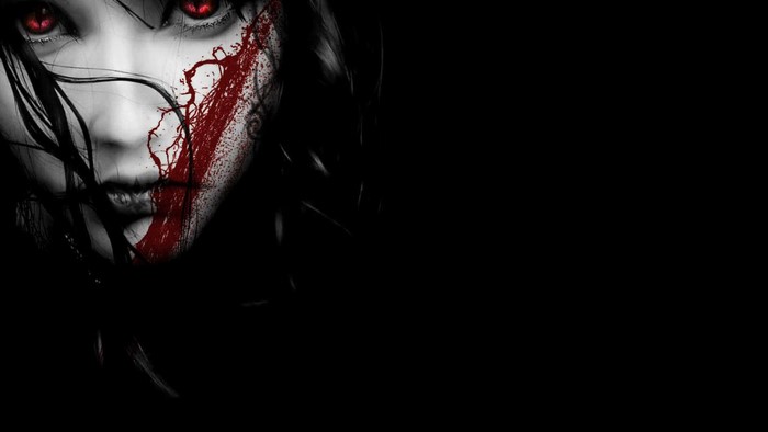 Woman with red eyes and blood splatter