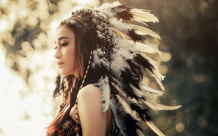 Profile of Woman Wearing Feathered Headdress