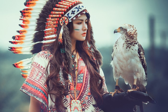 Woman in Native American Headdress with Eagle