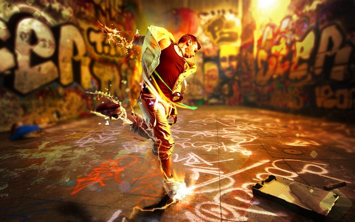 Man dancing in a graffiti-covered alleyway