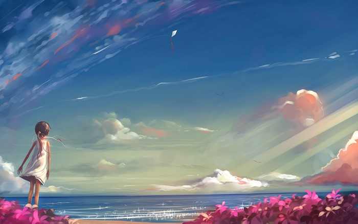 Girl flying a kite at the beach