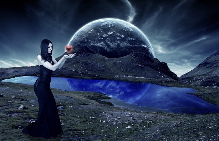 Woman holding a glowing heart with a planet in the background