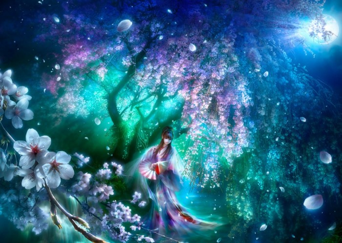 Woman in a flowing dress under a blooming tree at night