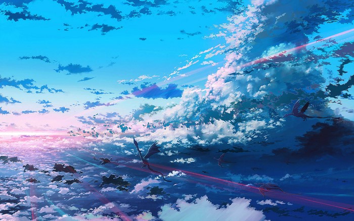 Dragons flying through clouds at sunset