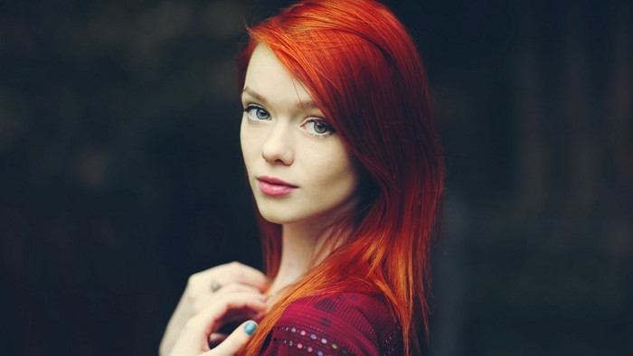 Woman with red hair and blue eyes