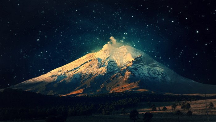 Volcano under a starry night sky
