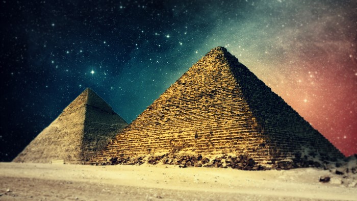 Ancient Egyptian Pyramids Under Starry Night Sky